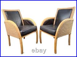 2 Rattan and black leather armchairs Lloyd Loom armchair