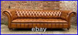 An Elegant Long Fully Buttoned Four Seater Tan leather Chesterfield Sofa