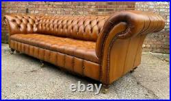 An Elegant Long Fully Buttoned Four Seater Tan leather Chesterfield Sofa