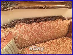 Antique French sofa in walnut wood with beautiful carving details. Tufted sides