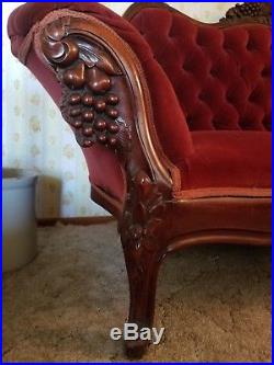 Antique Victorian style hand carved frame loveseat. Circa late 40's