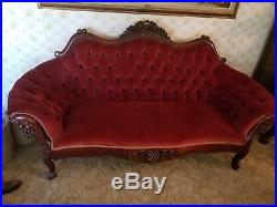 Antique Victorian style hand carved frame loveseat. Circa late 40's
