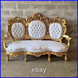 Antique sofa in Rococo style in white and gold, magnificent design and style