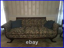 Couch Genuine Duncan Phyfe sofa. Note brass decorative protectors on mahogany
