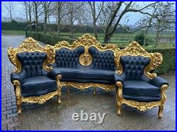 Italian style Baroque sofa with 4 chairs in black leather. 1920