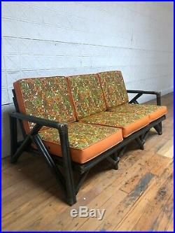 Mid Century Modern Rattan Sofa with Vintage Floral Patterned Upholstery