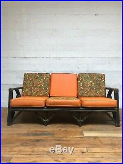 Mid Century Modern Rattan Sofa with Vintage Floral Patterned Upholstery