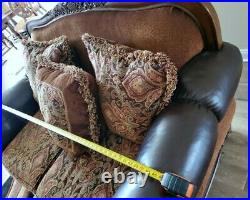 Pick up only FABRIC AND FAUX LEATHER LOVESEAT WITH ORNATE CARVED WOOD. Exc cond