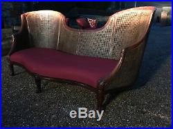 Reduced to sell 20 century rosewood double cane Bergere serpentine canope sofa