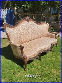 VICTORIAN ROCOCO REVIVAL CARVED AND UPHOLSTERED SOFA Elija Galusha