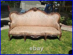 VICTORIAN ROCOCO REVIVAL CARVED AND UPHOLSTERED SOFA Elija Galusha