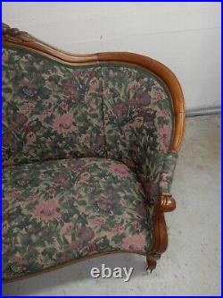 Victorian Era Upostered Parlor Sofa Hand Carvings With Vintage Porcelain Casters