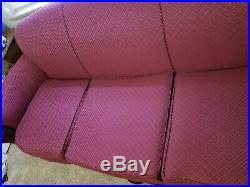 Vintage antique upholstered sofa with beautiful carved details